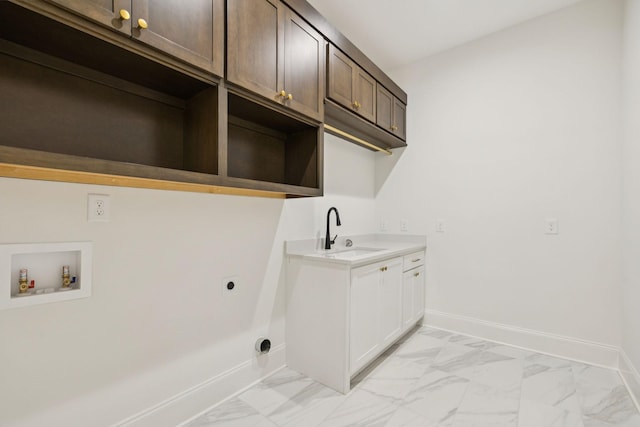 508 Matthew Miller Dr, Smyrna, TN 37167 - laundry room featuring light marble finish flooring, electric dryer hookup, washer hookup, and cabinet space
