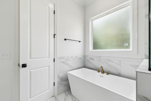 508 Matthew Miller Dr, Smyrna, TN 37167 - full bathroom featuring a freestanding bath and marble look tile flooring