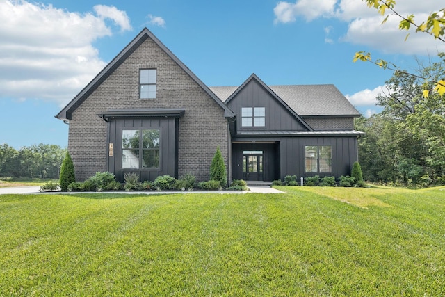 508 Matthew Miller Dr, Smyrna, TN 37167 - view of front of property with board and batten siding, a front lawn, and brick siding