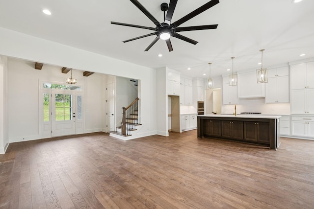 508 Matthew Miller Dr, Smyrna, TN 37167 - kitchen featuring wood finished floors, white cabinets, light countertops, and recessed lighting