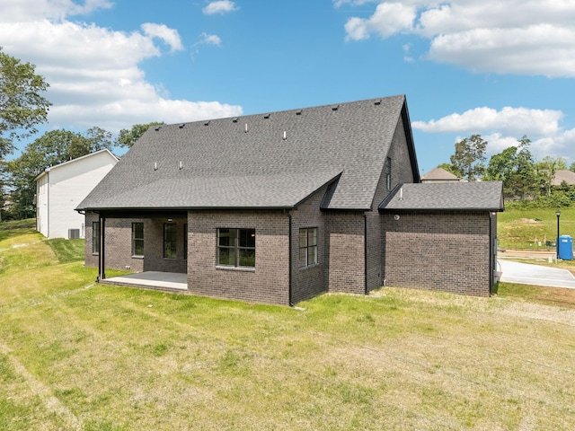 508 Matthew Miller Dr, Smyrna, TN 37167 - rear view of house featuring brick siding, a shingled roof, a patio, and a yard