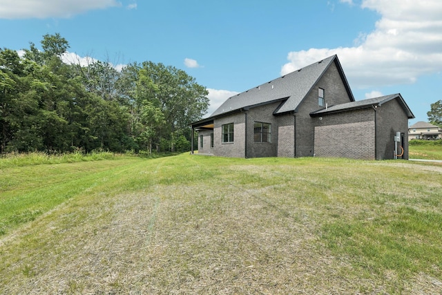508 Matthew Miller Dr, Smyrna, TN 37167 - back of property with brick siding, a lawn, and roof with shingles