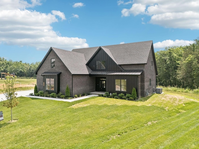 508 Matthew Miller Dr, Smyrna, TN 37167 - modern inspired farmhouse with a standing seam roof, board and batten siding, a front lawn, a metal roof, and roof with shingles