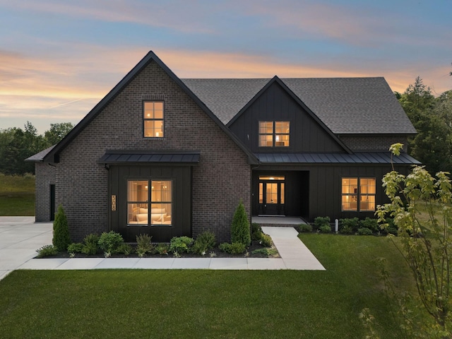 508 Matthew Miller Dr, Smyrna, TN 37167 - modern inspired farmhouse featuring board and batten siding, a standing seam roof, a front yard, covered porch, and roof with shingles