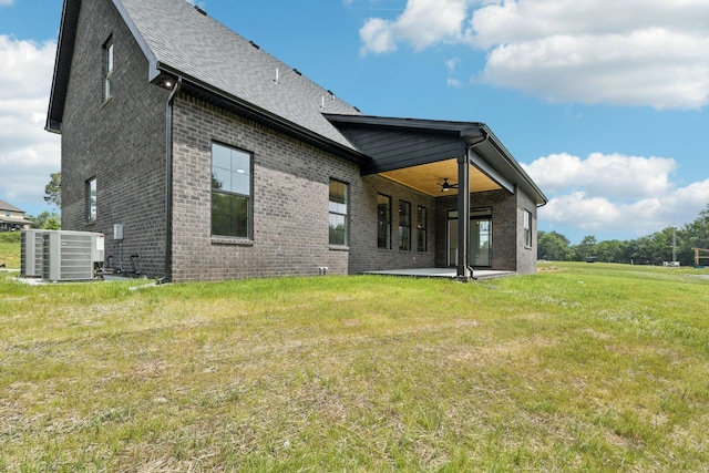 508 Matthew Miller Dr, Smyrna, TN 37167 - back of house with a ceiling fan, brick siding, and a yard