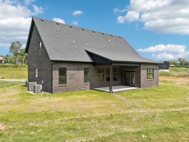 508 Matthew Miller Dr, Smyrna, TN 37167 - back of house featuring a patio area, brick siding, a shingled roof, and a lawn