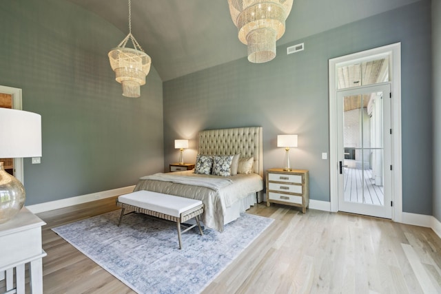 8876 Edgecomb Dr, College Grove, TN 37046 - bedroom with a chandelier, wood finished floors, and high vaulted ceiling