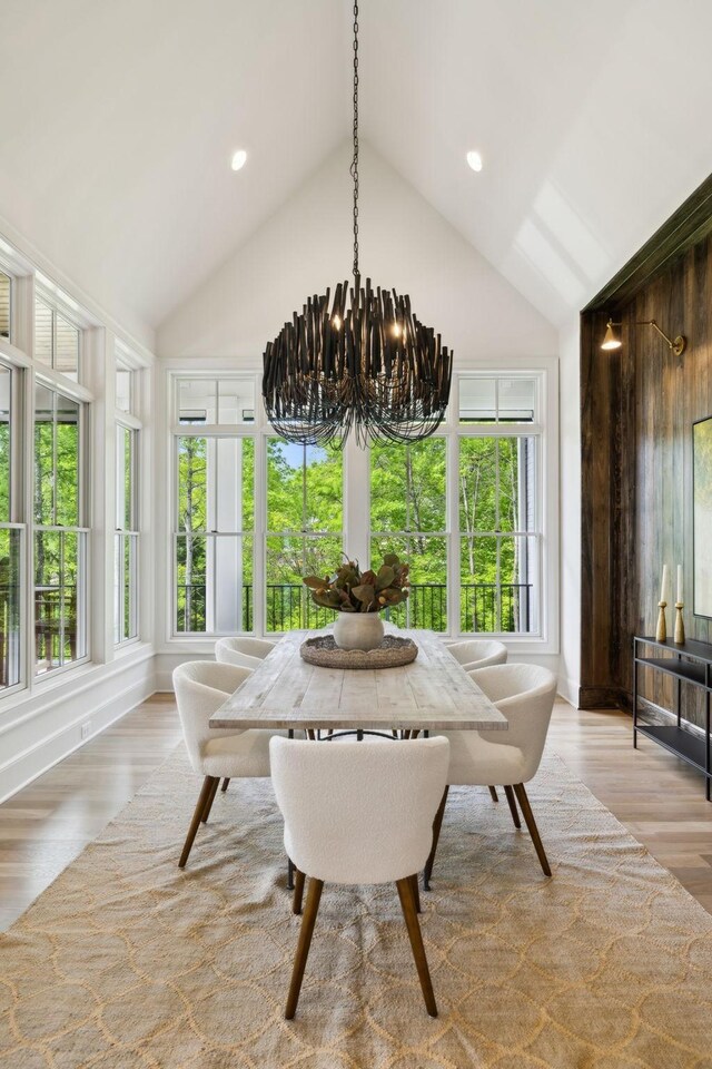 8876 Edgecomb Dr, College Grove, TN 37046 - dining room with a chandelier, wood finished floors, vaulted ceiling, and recessed lighting