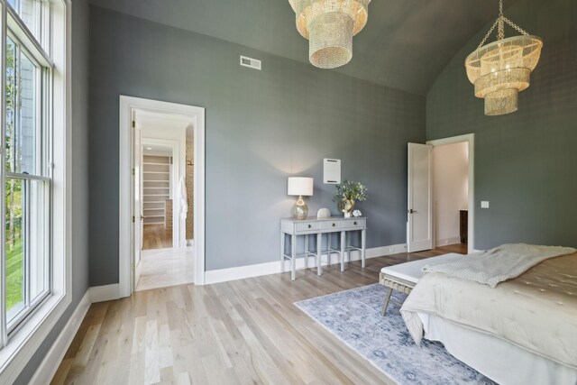8876 Edgecomb Dr, College Grove, TN 37046 - bedroom with a chandelier, high vaulted ceiling, and wood finished floors