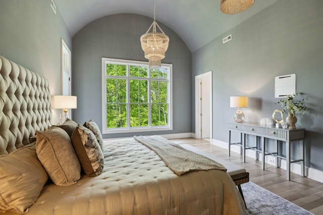 8876 Edgecomb Dr, College Grove, TN 37046 - bedroom with wood finished floors, lofted ceiling, and a chandelier
