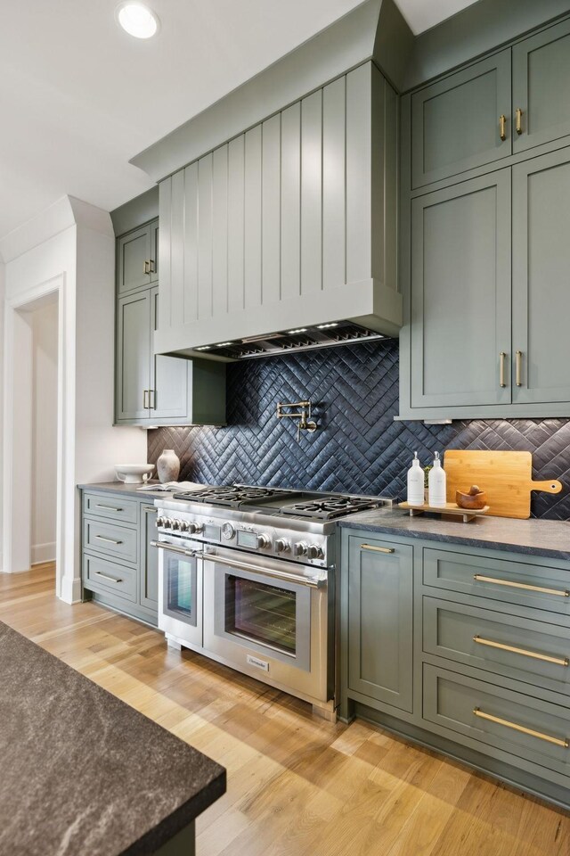 8876 Edgecomb Dr, College Grove, TN 37046 - kitchen featuring range with two ovens, green cabinets, backsplash, and recessed lighting