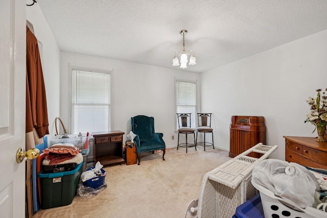 8663 Dog Branch Rd, Mount Pleasant, TN 38474 - sitting room with carpet, a chandelier, and a textured ceiling