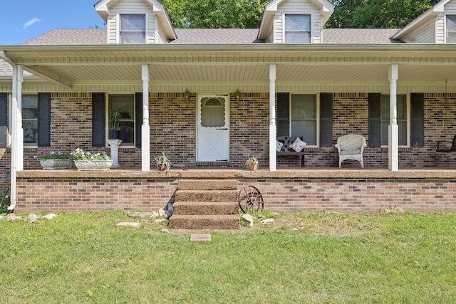 8663 Dog Branch Rd, Mount Pleasant, TN 38474 - property entrance with brick siding, covered porch, and roof with shingles