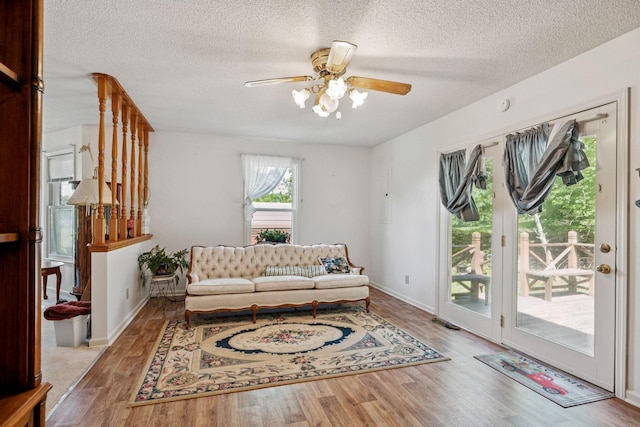 8663 Dog Branch Rd, Mount Pleasant, TN 38474 - living area with wood finished floors, ceiling fan, and a textured ceiling
