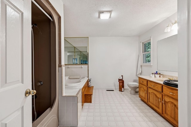 8663 Dog Branch Rd, Mount Pleasant, TN 38474 - bathroom featuring a bath, vanity, a textured ceiling, tile patterned floors, and a shower