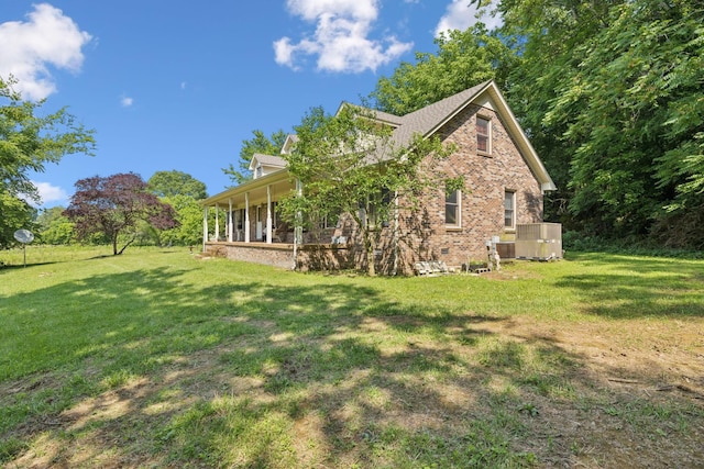 8663 Dog Branch Rd, Mount Pleasant, TN 38474 - view of side of home featuring brick siding and a lawn
