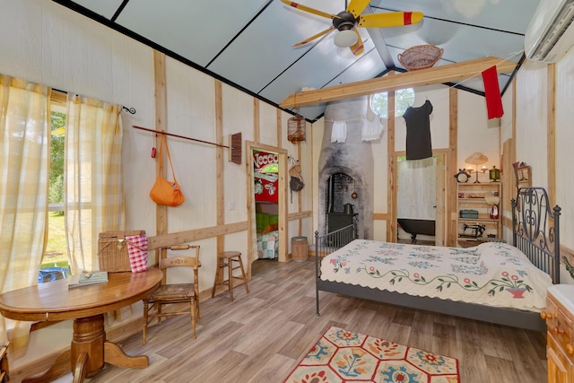 997 W 12th St, Chickamauga, GA 30707 - bedroom featuring a wall mounted AC, multiple windows, and wood finished floors