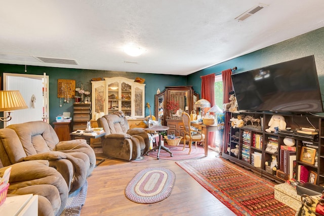 997 W 12th St, Chickamauga, GA 30707 - living room with wood finished floors and attic access