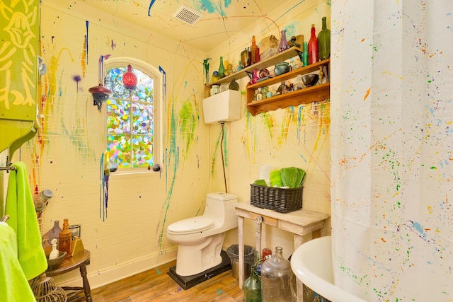 997 W 12th St, Chickamauga, GA 30707 - bathroom with wood finished floors, a bath, and a shower with shower curtain