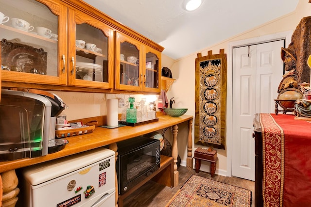 997 W 12th St, Chickamauga, GA 30707 - bar area with lofted ceiling, black microwave, fridge, and wood finished floors