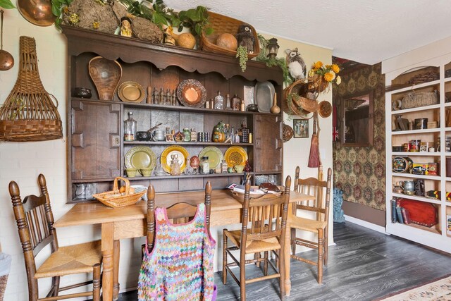 997 W 12th St, Chickamauga, GA 30707 - dining space with dark wood-style floors and baseboards