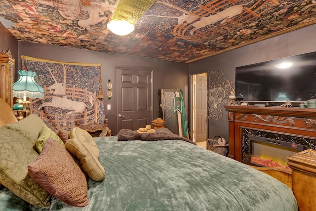 997 W 12th St, Chickamauga, GA 30707 - bedroom featuring a glass covered fireplace and an ornate ceiling