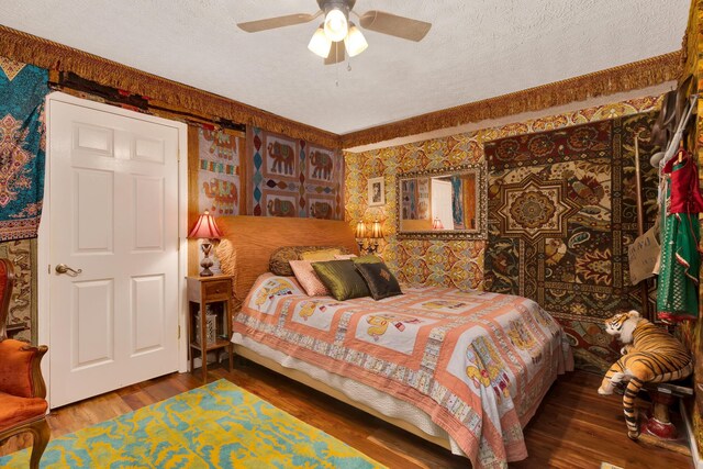 997 W 12th St, Chickamauga, GA 30707 - bedroom with wood finished floors, wallpapered walls, a textured ceiling, and a ceiling fan