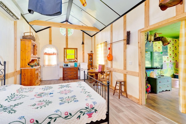 997 W 12th St, Chickamauga, GA 30707 - bedroom featuring a wall unit AC, wood finished floors, and high vaulted ceiling
