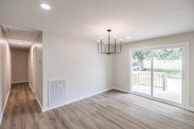 3046 Patton Branch Rd, Goodlettsville, TN 37072 - spare room featuring attic access, light wood-style floors, a chandelier, and recessed lighting