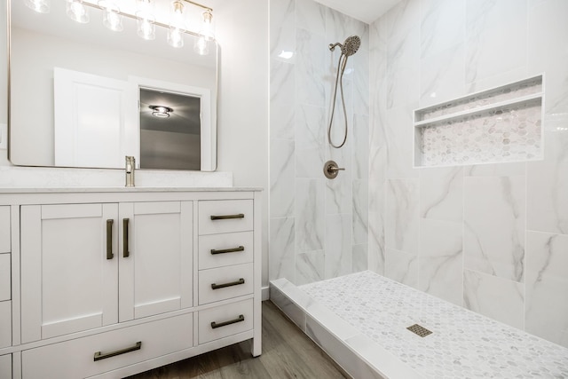 3046 Patton Branch Rd, Goodlettsville, TN 37072 - bathroom with tiled shower, vanity, and wood finished floors