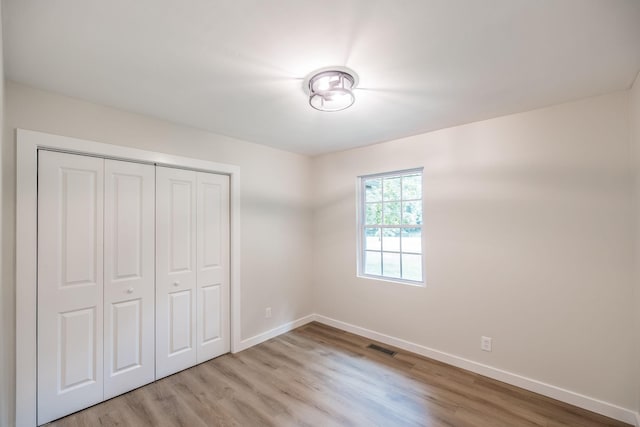 3046 Patton Branch Rd, Goodlettsville, TN 37072 - unfurnished bedroom featuring light wood-type flooring and a closet