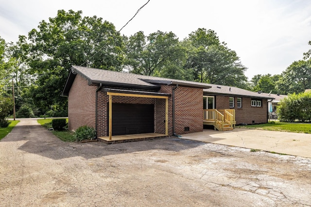 3046 Patton Branch Rd, Goodlettsville, TN 37072 - view of property exterior featuring a garage and brick siding