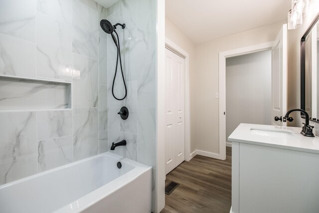 3046 Patton Branch Rd, Goodlettsville, TN 37072 - bathroom with vanity, shower / bathtub combination, and wood finished floors