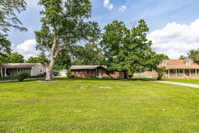 3046 Patton Branch Rd, Goodlettsville, TN 37072 - view of green lawn featuring a porch and an outdoor structure