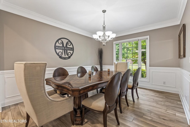 108 Center Park Ln, Oak Ridge, TN 37830 - dining area with a chandelier, a wainscoted wall, ornamental molding, a decorative wall, and light wood finished floors