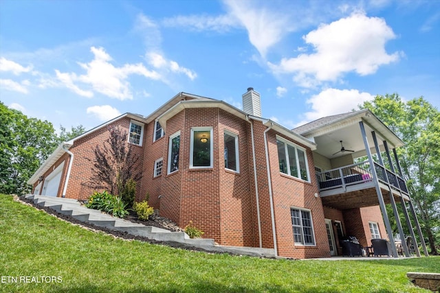 108 Center Park Ln, Oak Ridge, TN 37830 - back of property with brick siding, a balcony, a ceiling fan, a chimney, and a lawn