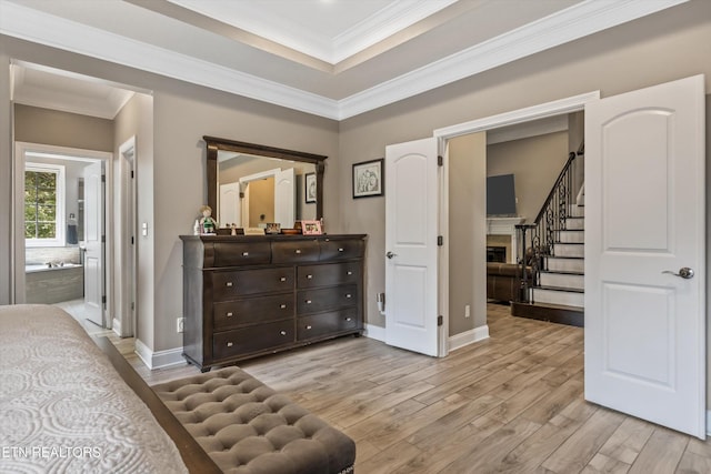 108 Center Park Ln, Oak Ridge, TN 37830 - bedroom featuring light wood finished floors, a fireplace, crown molding, and connected bathroom