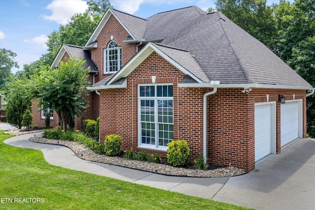 108 Center Park Ln, Oak Ridge, TN 37830 - view of front of property with brick siding, a garage, a shingled roof, and a front yard