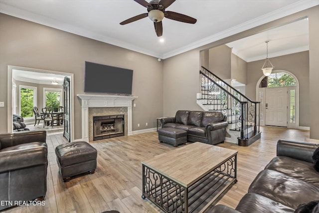 108 Center Park Ln, Oak Ridge, TN 37830 - living room featuring stairway, ceiling fan, wood finished floors, ornamental molding, and a fireplace