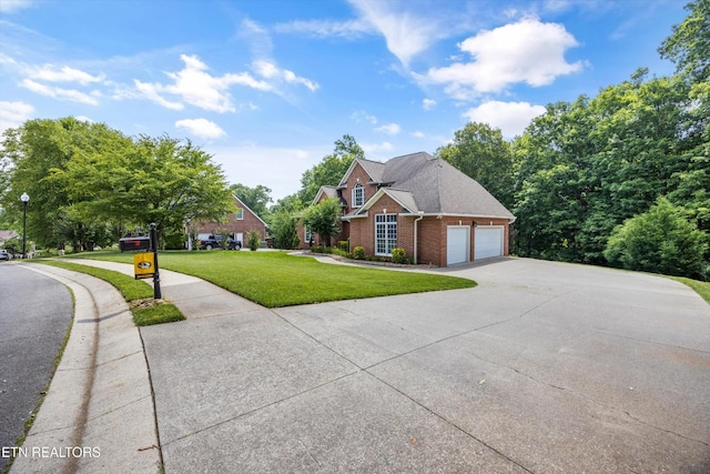 108 Center Park Ln, Oak Ridge, TN 37830 - traditional home with driveway, an attached garage, brick siding, and a front lawn