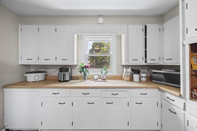 3205 Sylvia Rd, Dickson, TN 37055 - kitchen with stainless steel microwave and white cabinetry
