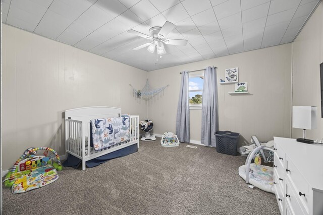 3205 Sylvia Rd, Dickson, TN 37055 - bedroom featuring a crib, carpet, and a ceiling fan