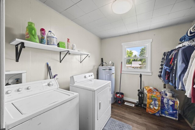 3205 Sylvia Rd, Dickson, TN 37055 - washroom with water heater, separate washer and dryer, and dark wood-style flooring