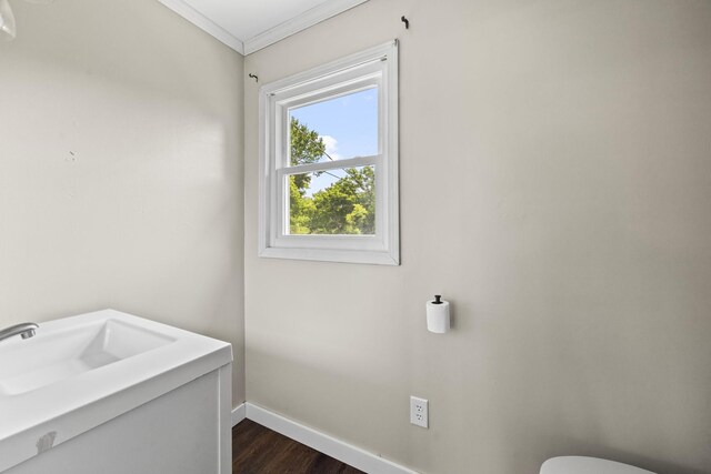 3205 Sylvia Rd, Dickson, TN 37055 - half bathroom featuring wood finished floors, ornamental molding, and vanity