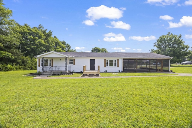 3205 Sylvia Rd, Dickson, TN 37055 - back of house with a sunroom, a lawn, an attached carport, and covered porch