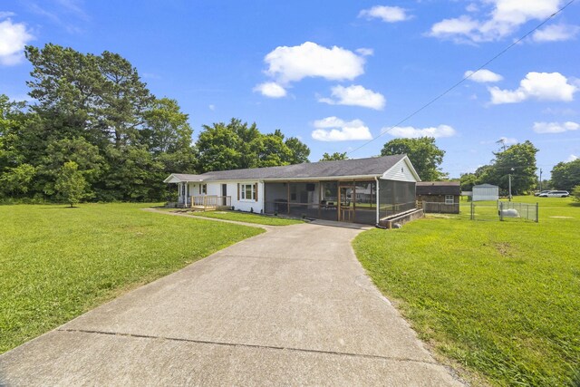 3205 Sylvia Rd, Dickson, TN 37055 - ranch-style house featuring a sunroom, driveway, and a porch