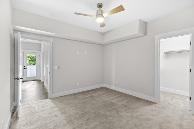 1227 N Avondale Cir, Nashville, TN 37207 - unfurnished bedroom featuring light carpet, a spacious closet, a ceiling fan, and a closet