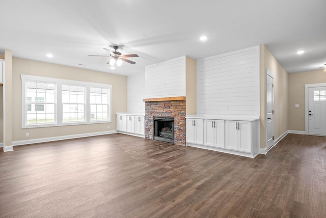 104 Hummingbird Way, Clarksville, TN 37043 - unfurnished living room with ceiling fan, dark wood-type flooring, a fireplace, and recessed lighting