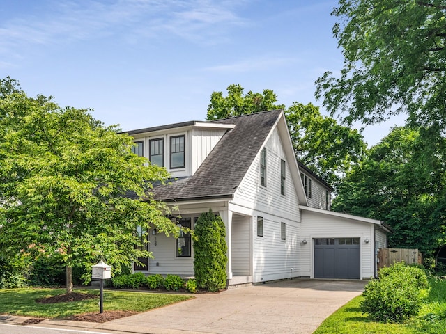 159 Acton St, Franklin, TN 37064 - view of home's exterior with concrete driveway, an attached garage, and a shingled roof