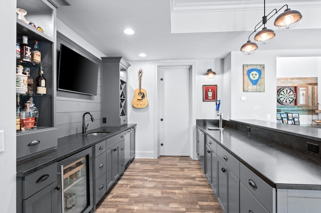 1542 Amesbury Ln, Franklin, TN 37069 - kitchen with beverage cooler, gray cabinets, light wood-style floors, and recessed lighting